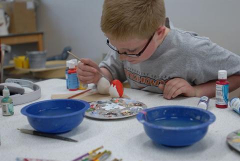 Child Painting Ceramic Egg