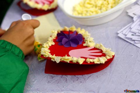 child making valentine's day card