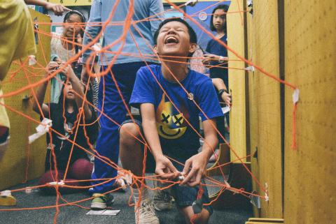 kids playing with laser maze