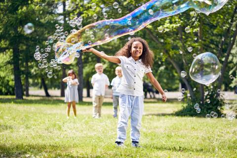 kids playing with bubbles