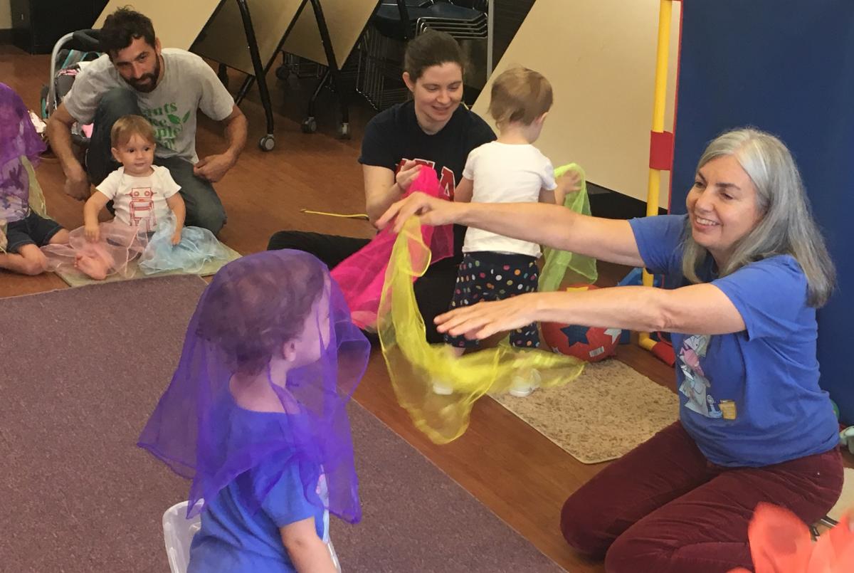 children playing with scarves