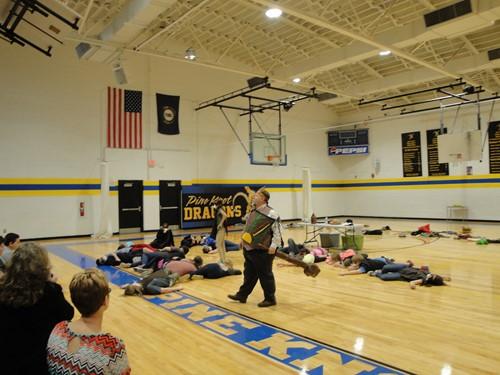 Dane Hosler performing for a school